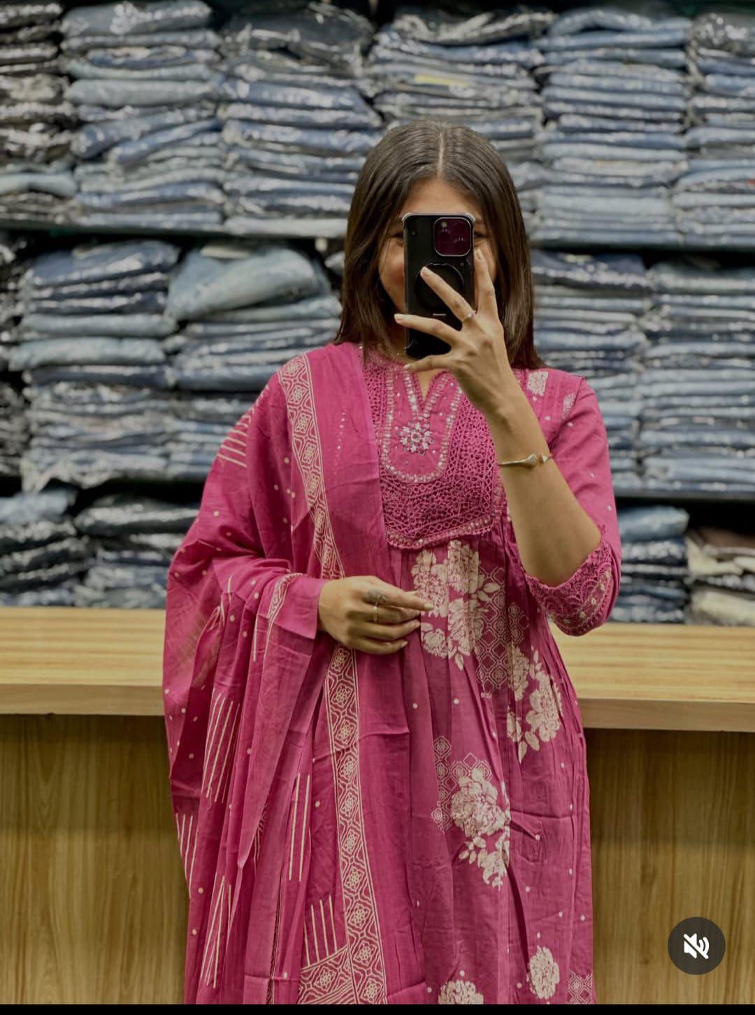 pink printed Anarkali kurti featuring white floral patterns and embroidered
