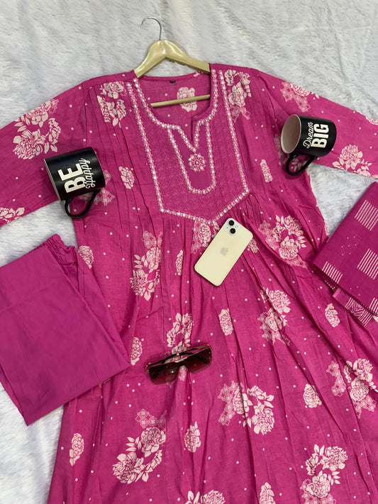 pink printed Anarkali kurti featuring white floral patterns and embroidered