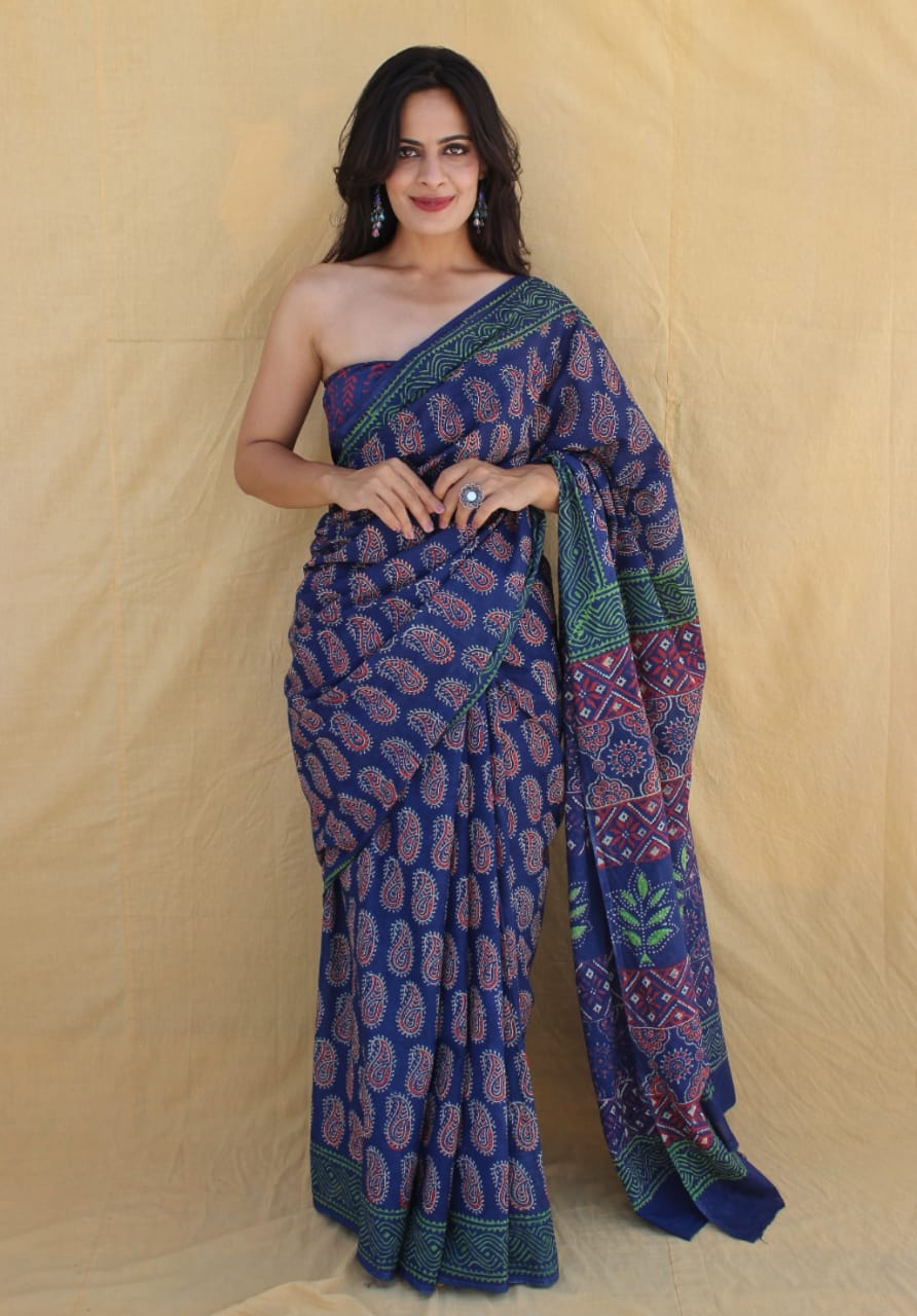 Hand-detailed mul cotton saree with cultural prints.