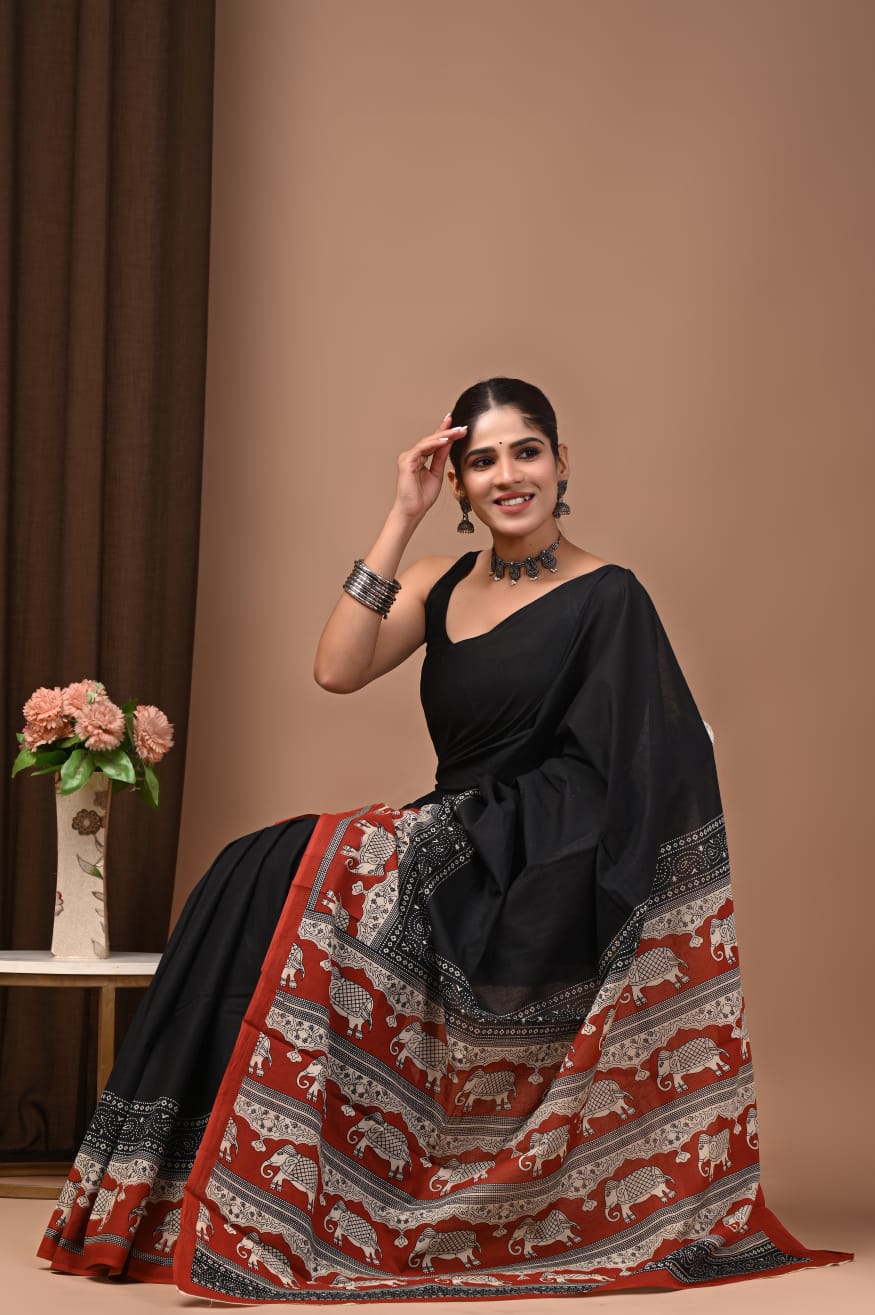 Artisanal cotton mul saree with hand-detailed block designs.