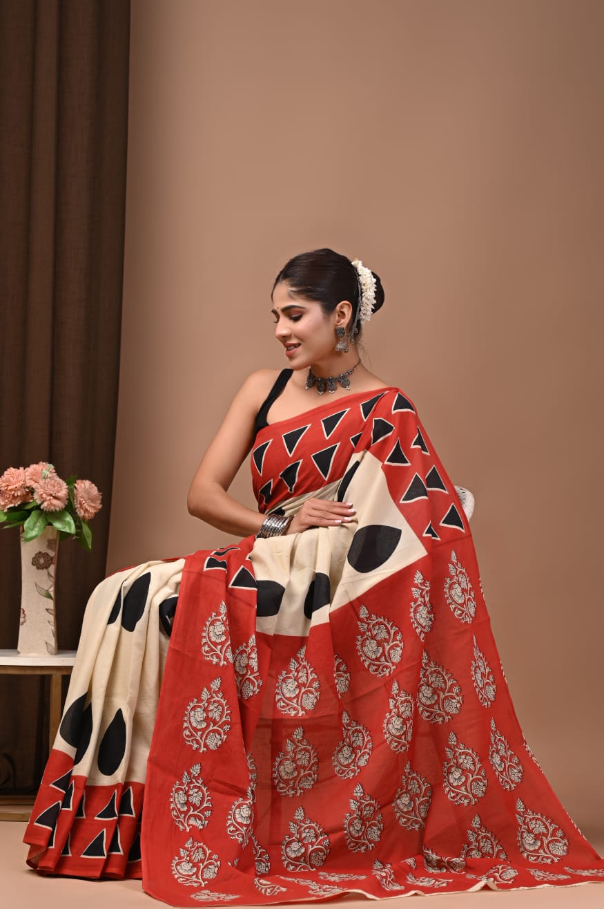 Naturally woven mulmul cotton saree with artisanal finishing.