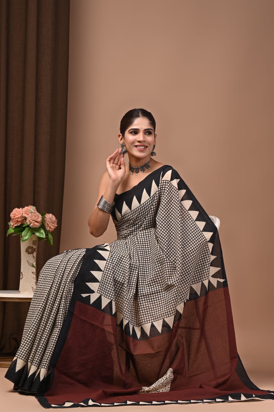 Flowy cotton mulmul saree with block printed detailing.