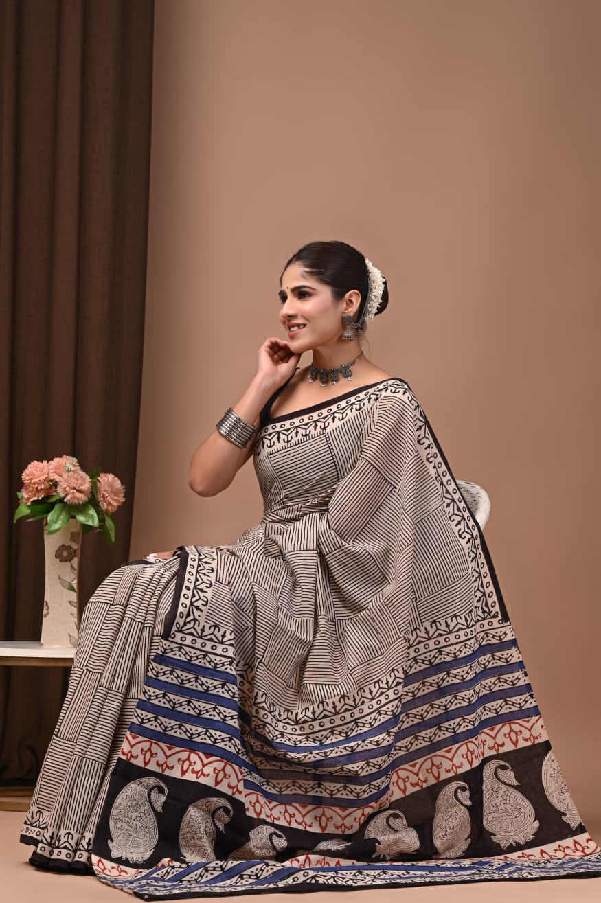 Pure cotton mul saree showcasing natural hand prints.