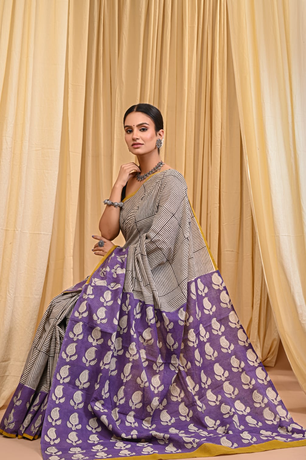 Traditional hand block mulmul saree, crafted in cotton.