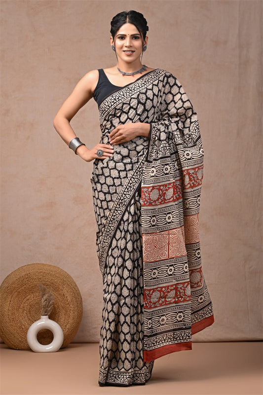 Traditional cotton mul saree with breathable weave.