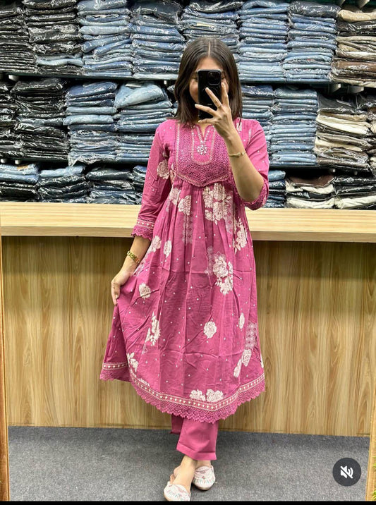 pink printed Anarkali kurti featuring white floral patterns and embroidered