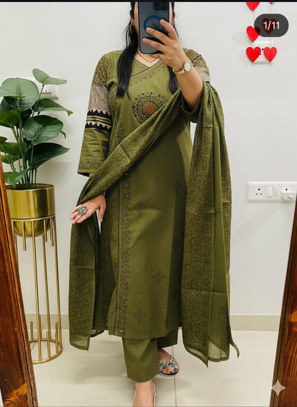 green kurti pant with a floral print and mirror work embroidery. 
