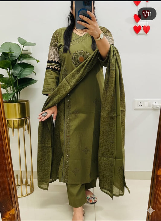 green kurti pant with a floral print and mirror work embroidery. 