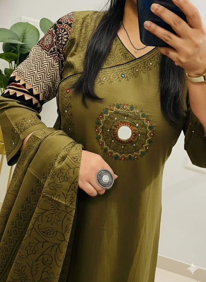 green kurti pant with a floral print and mirror work embroidery. 