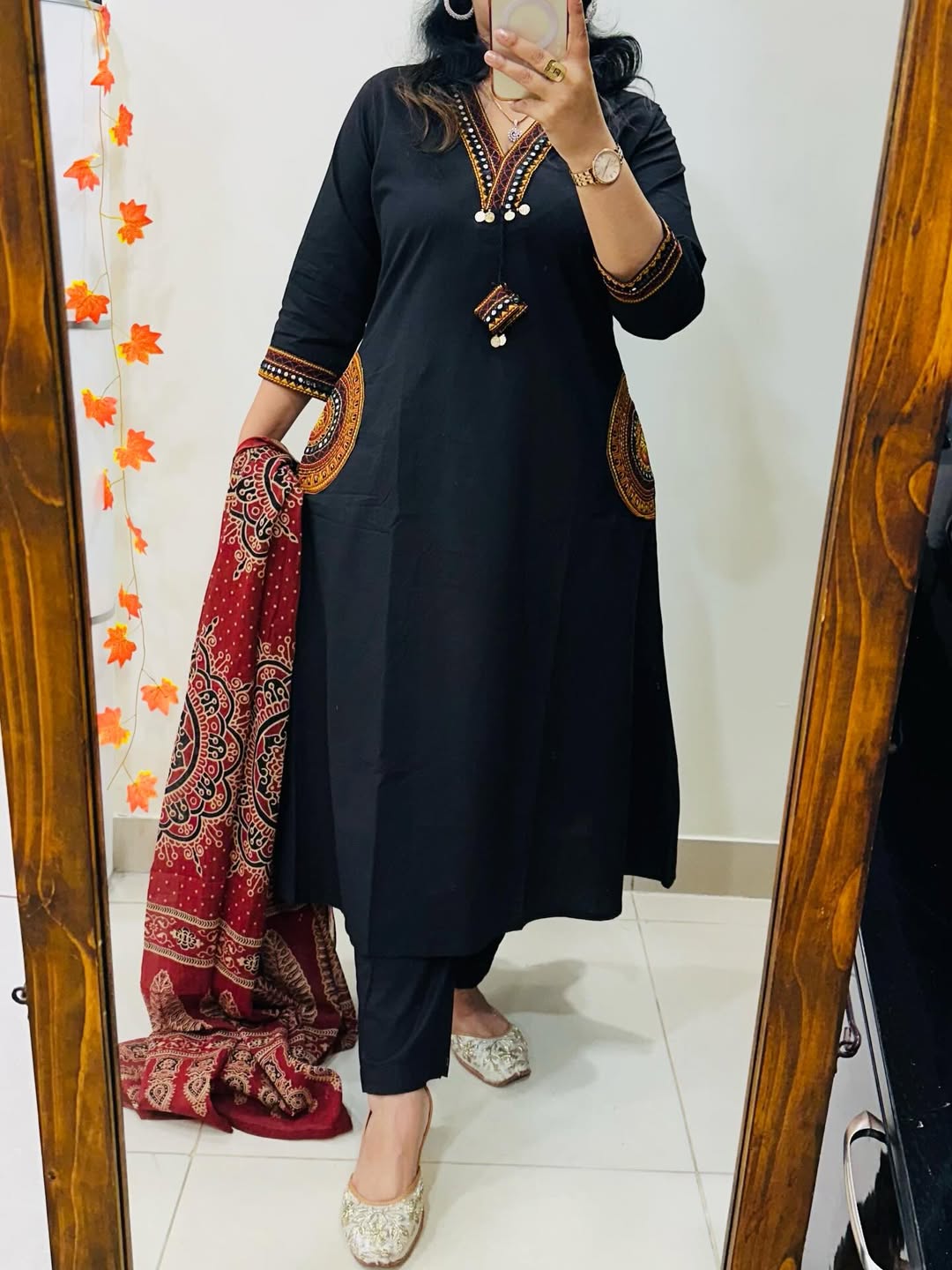 black cotton A-line kurta, pant, and dupatta set
