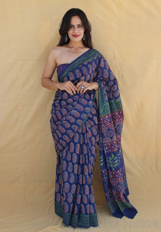 Hand-detailed mul cotton saree with cultural prints.