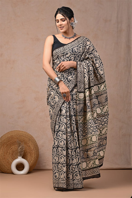 Naturally woven mulmul cotton saree with artisanal finishing.