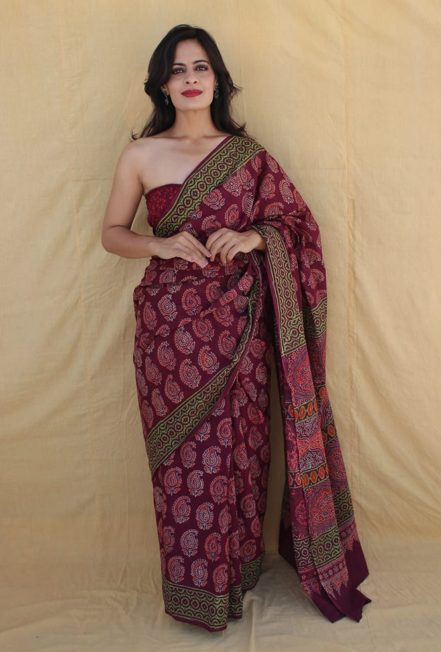 Authentic weave mulmul saree, elegant draping style.