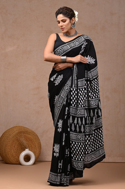 Effortless chic cotton mul saree, soft flowy weave.