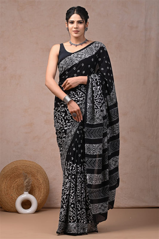 Artisanal cotton mul saree with hand-detailed block designs.